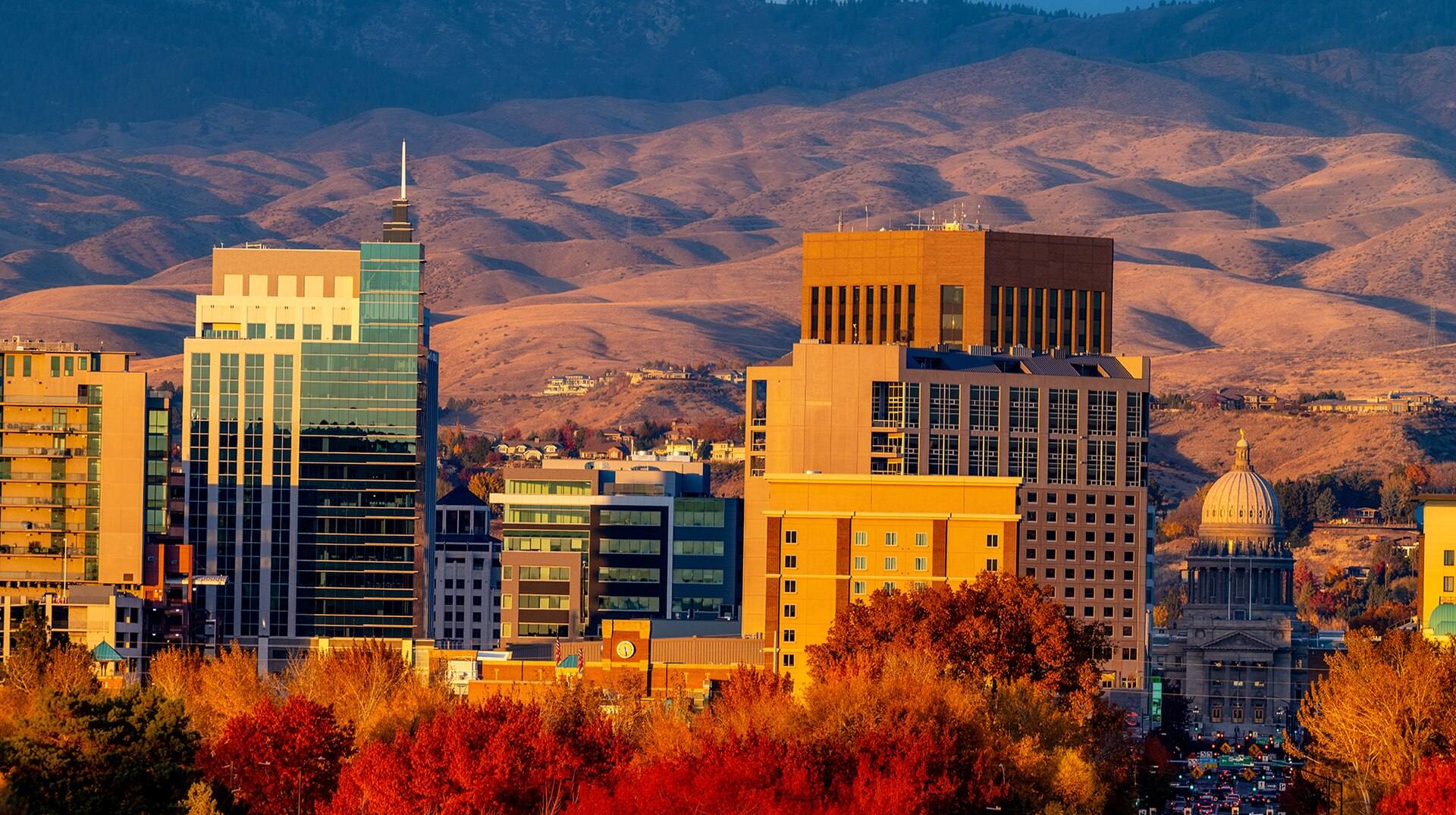 The Boise skyline and Capitol in fall color at sunset.